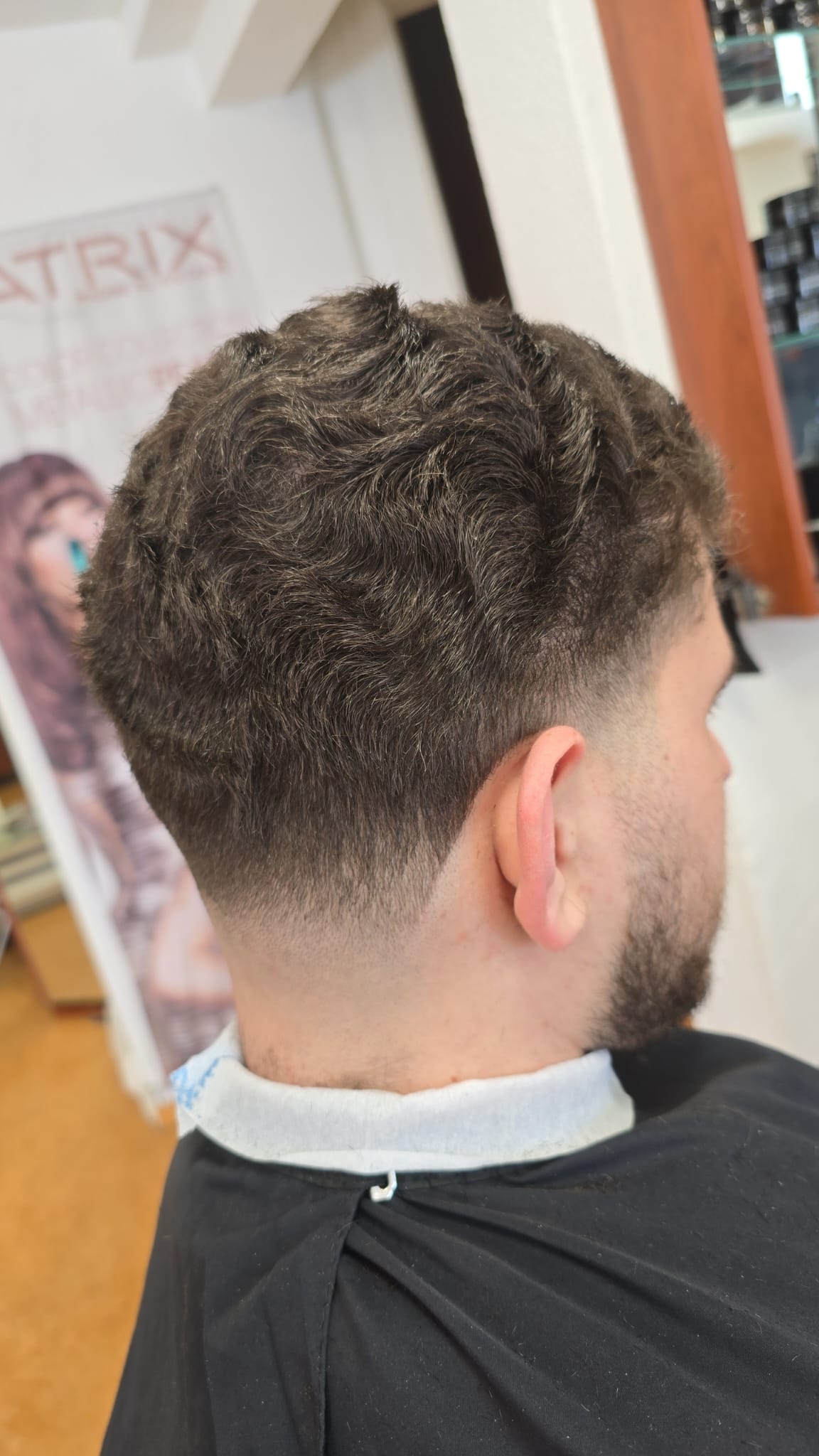 Client seated in the salon during a service